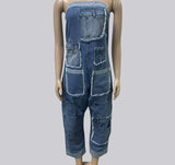Mannequin wearing a denim strapless jumpsuit with a plain background
