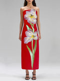 Red strapless dress with floral design on a plain background