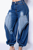 Blue denim baggy pants on a white background