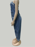 Mannequin wearing a blue denim jumpsuit against a plain white wall.