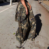 Camouflage backpack on a concrete surface