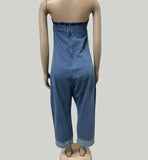 Mannequin wearing a blue denim jumpsuit against a plain background